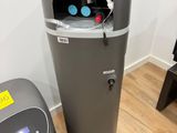 a water cooler and a trash can in the corner of a room