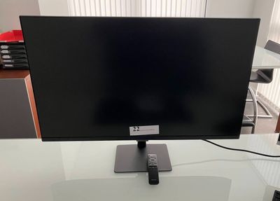 an image of a flat screen tv on a glass table