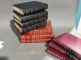 four books stacked on top of each other on a table