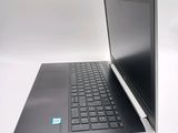 two laptops sitting side by side on a white surface