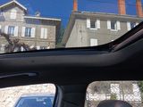 a view of a building from inside of a car