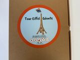 a cardboard box with a picture of the eiffel tower on it