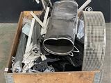a wooden box with a bunch of metal items inside of it