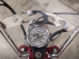 a close up of a motorcycle handlebar with a speedometer on it