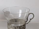 a glass cup that is sitting on a table