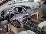 a car dashboard with a steering wheel and a dash board