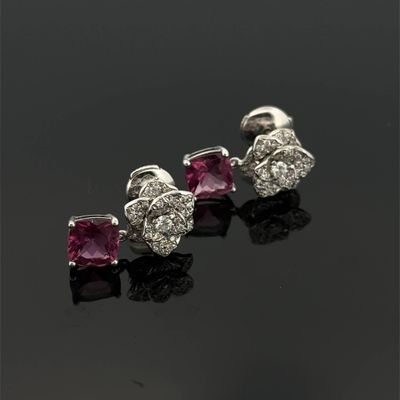 a pair of ruby and diamond earrings