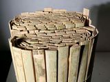 a basket made out of bamboo sticks on a table