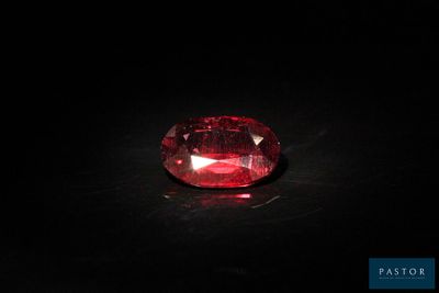 a red diamond on a black surface