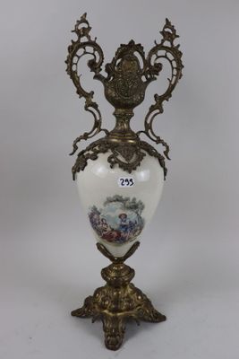 a vase that has a picture on it on a stand