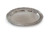 an oval silver plate with a decorative design on the rim