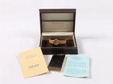 an image of a box with a watch inside of it on a white surface