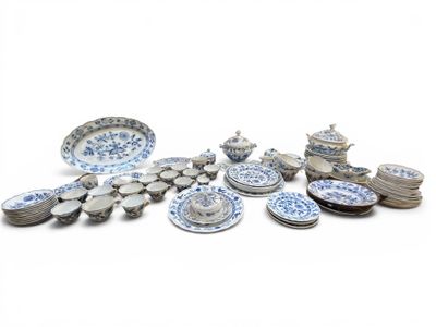 a lot of plates and bowls on the table