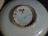 a close up of a plate with a tag on it