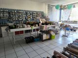 a large room with a lot of craft supplies on the tables