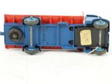 a blue and red toy train on a white surface