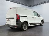 the rear end of a white van parked in a garage