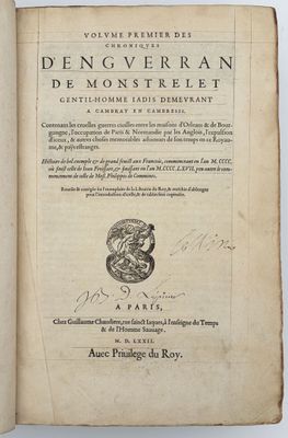 an open book with a drawing of a dragon on it