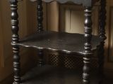 a black table with a basket of flowers on top of it