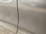 a close up of a car door with a sticker on it
