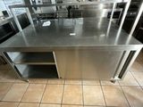 a large stainless steel counter in a commercial kitchen