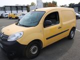 a small yellow van parked in a parking lot
