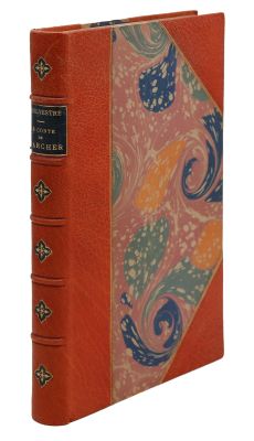 un livre orange avec une couverture décorative et un motif ornemental