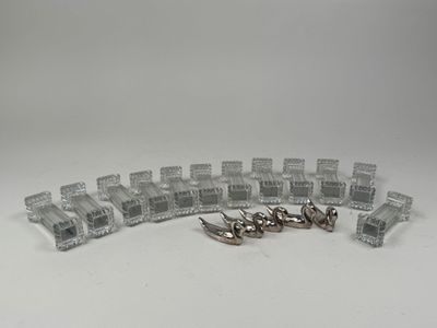 a lot of small pieces of plastic on a white surface