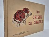 french children ' s book, les chiens de chasse, with a drawing of a dog in a red coat