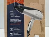 packaging of a hair dryer sitting on top of a cardboard box