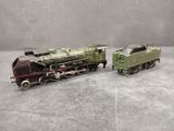 two toy trains that are sitting on a table