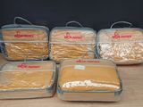 several bags of food sitting on top of a wooden table