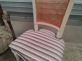 chair upholstered with a striped seat and back
