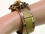a close up of a person ' s hand wearing a bracelet