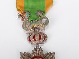 a medal with a crown and a star on it