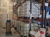a large warehouse filled with lots of containers and pallets