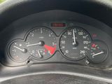 a close up of a car dashboard with a speedometer and gauges