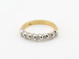 une bague en or et en argent sertie de cinq diamants