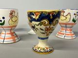 three egg cups sitting next to each other on a table
