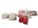 several bags of food sitting on top of each other on a white surface