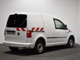 a white van is parked in a room with a checkered floor