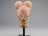 an image of a sculpture of a bear ' s head on a stand