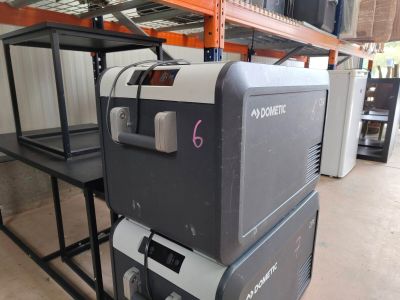 a machine that is sitting on a shelf in a warehouse