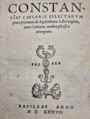 an old book with a drawing of a snake on it