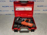 a red tool box with a stapler and a stapler in it