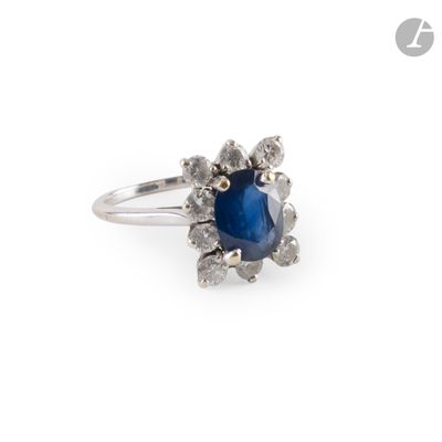 an image of a blue sapphire and diamond ring on a white background