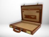 a brown suitcase with a brown handle on a white background