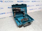 a blue tool box with a cord and a drill in it