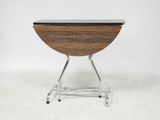 a close up of a table with a wooden top and metal legs