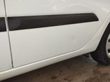 a white car with a black stripe on the side of it